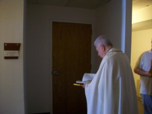 Fr. Gene Knocking at the Entrance